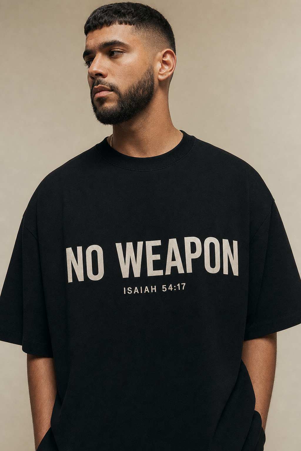 No Weapon Tee - model wearing black tee with bold cream chest print